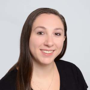 Smiling woman with long brown hair headshot